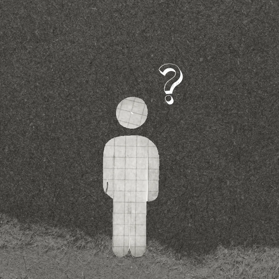 Paper figure cut-out with a question mark